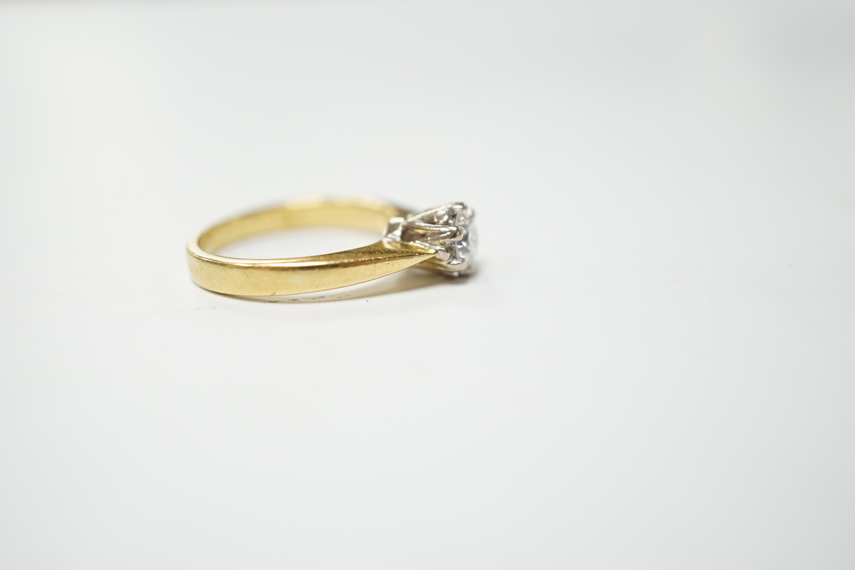 A modern 18ct gold and solitaire diamond set ring, the stone weighing 0.33ct, size I, gross weight 4.2 grams.